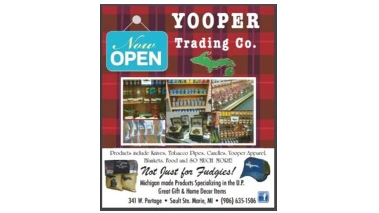 Yooper Trading Company graphic on top of red flannel.